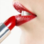Applying lipstick